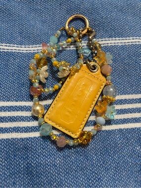 Coach Yellow Leather Tag with Beaded Charm Necklace with Floral Accents